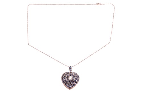 Lot 100 - A sapphire and diamond heart-shaped locket on...