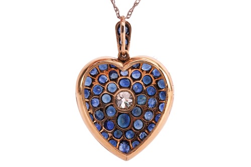 Lot 100 - A sapphire and diamond heart-shaped locket on...
