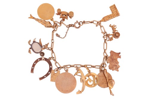 Lot 120 - A charm bracelet; comprising a Figaro link...
