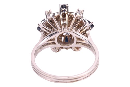 Lot 43 - A diamond and sapphire cluster ring,...