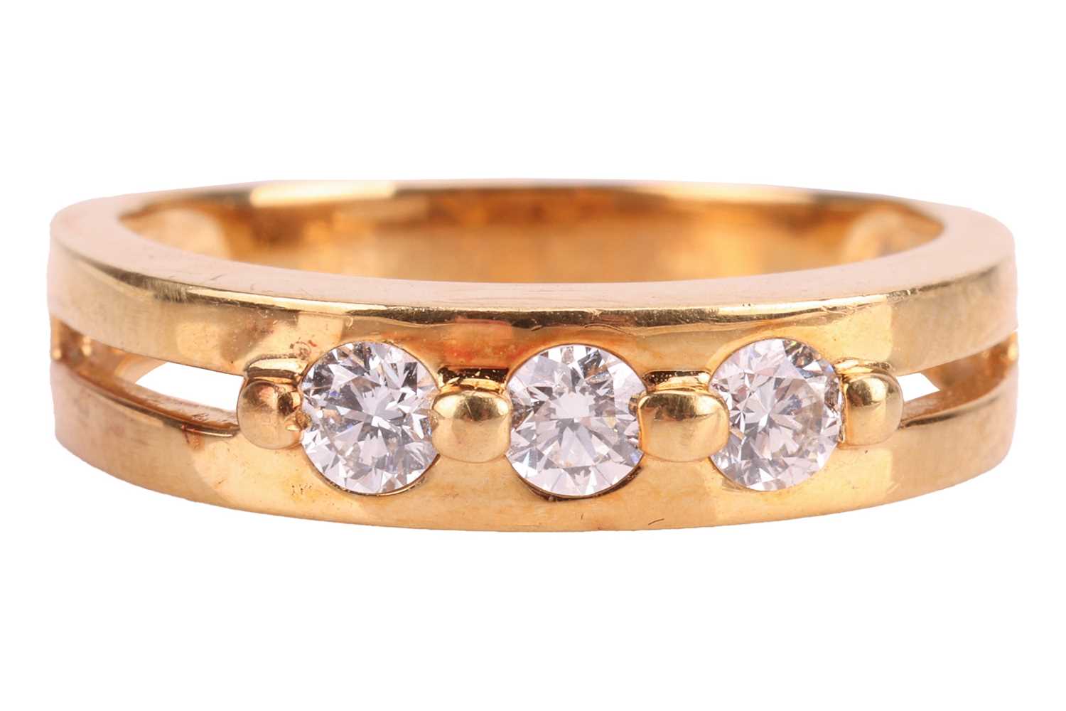 Lot 81 - A three-stone diamond ring with an estimated...
