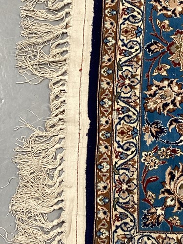 Lot 147 - A blue ground Isfahan prayer rug with a single...