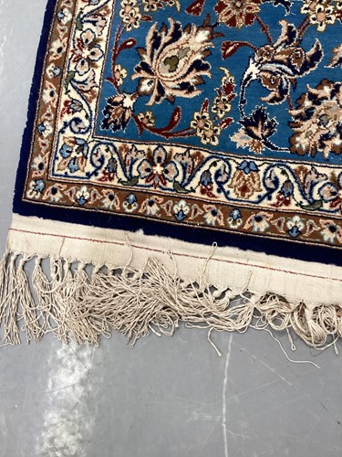 Lot 147 - A blue ground Isfahan prayer rug with a single...