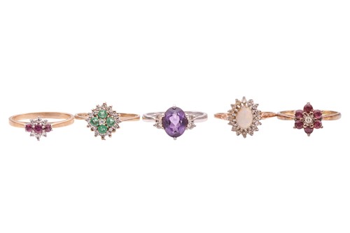 Lot 56 - A small group of five gem-set rings;...