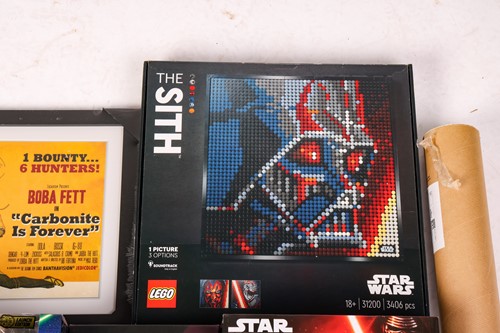 Lot 74 - A collection of Star Wars collectibles, to...