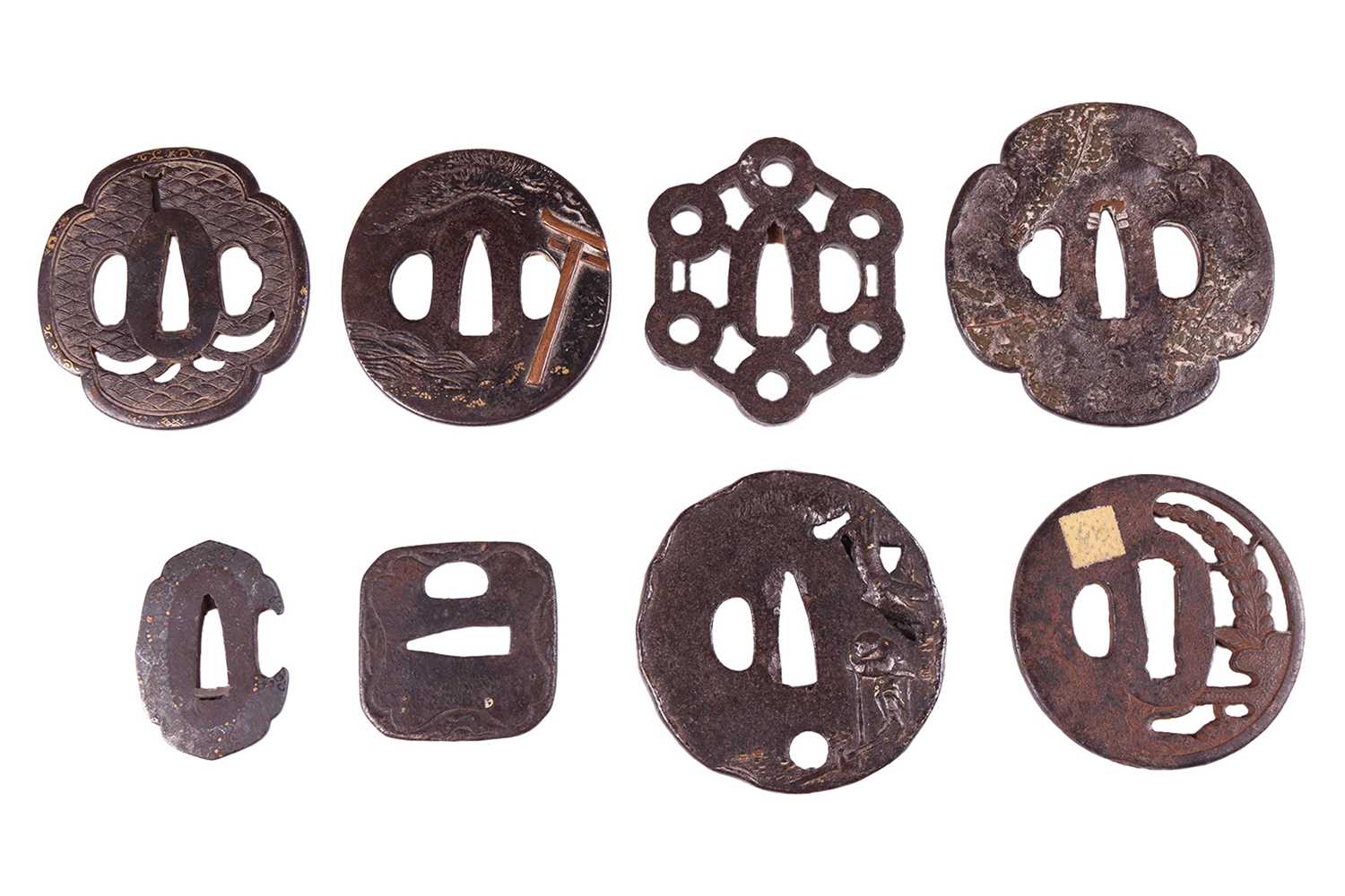 Lot 32 - A Japanese iron and mixed metal oval tsuba,...