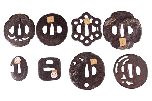 Lot 32 - A Japanese iron and mixed metal oval tsuba,...
