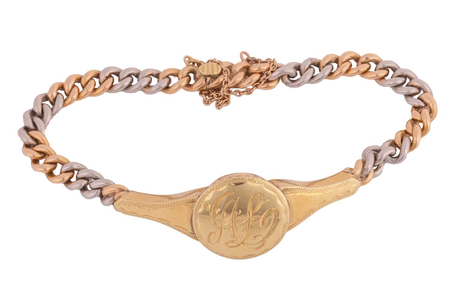 Lot 51 - A monogrammed bracelet, the central circular...