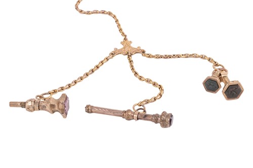 Lot 128 - A long fob chain and seals, comprising three...