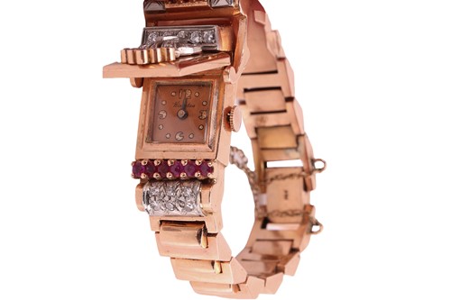 Lot 249 - A diamond and ruby-set concealed cocktail...