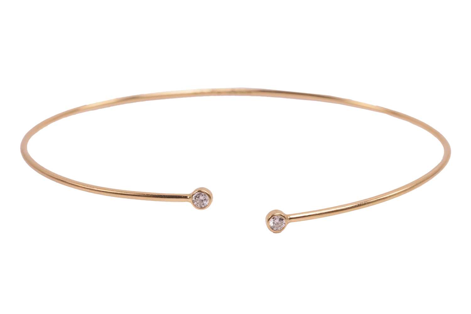 Lot 125 - Tiffany & Co. - a diamond hoop bangle by Elsa...