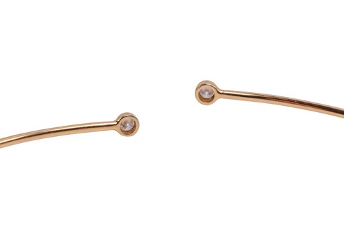 Lot 125 - Tiffany & Co. - a diamond hoop bangle by Elsa...