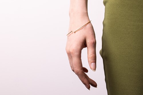 Lot 125 - Tiffany & Co. - a diamond hoop bangle by Elsa...