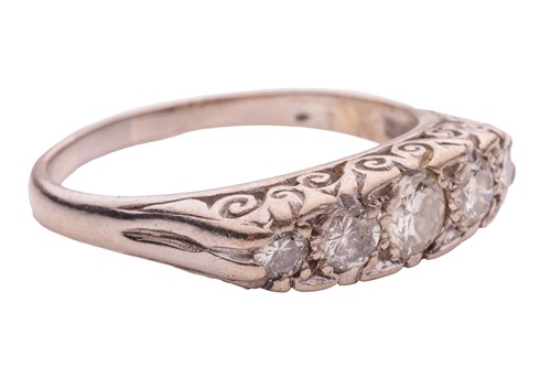 Lot 124 - A diamond half-hoop ring, with an estimated...