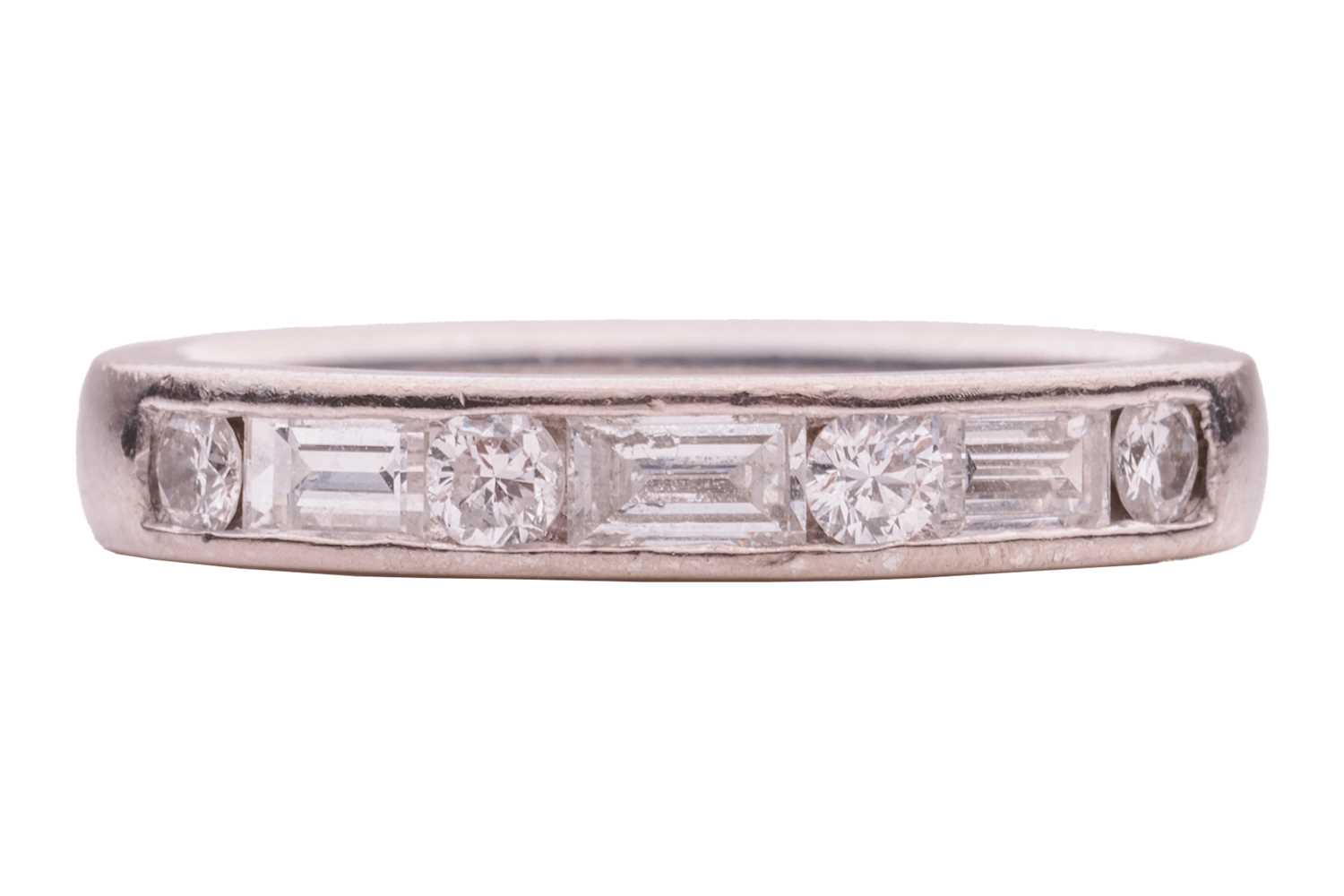 Lot 109 - A diamond half-eternity ring, with an...