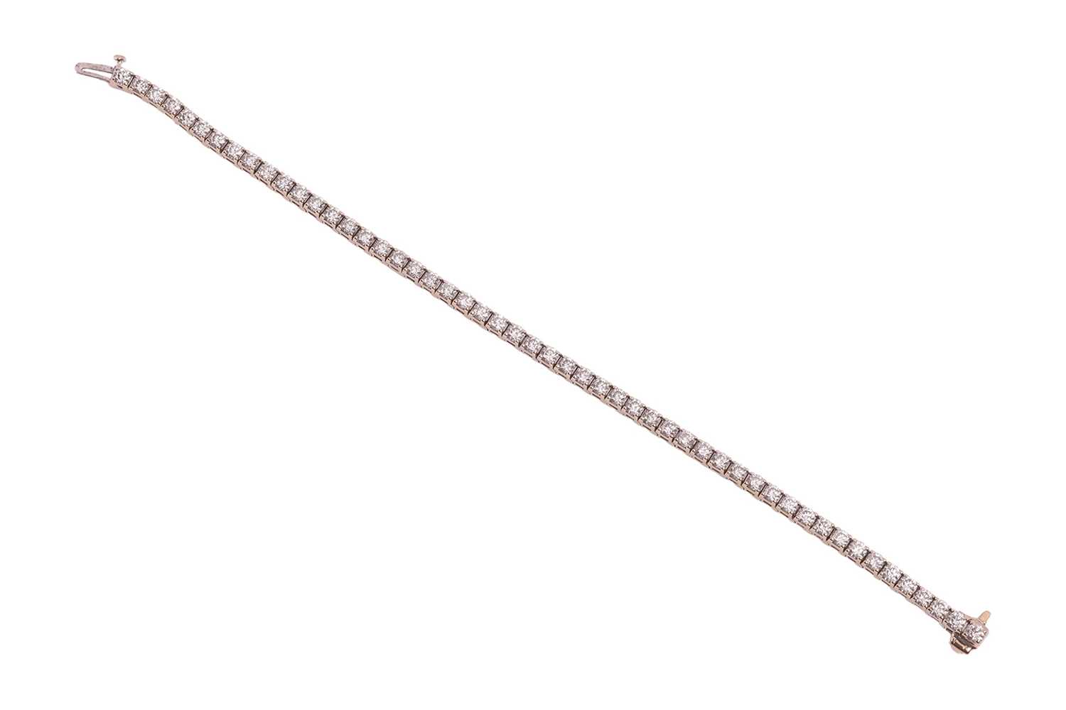 Lot 52 - A diamond line bracelet, with an estimated...