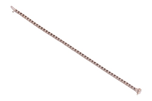 Lot 52 - A diamond line bracelet, with an estimated...