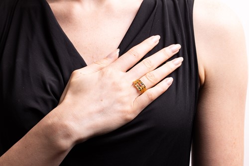 Lot 73 - A nine-stone Navaratna ring in 22ct yellow...
