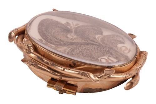 Lot 89 - A George III hairwork mourning brooch, of oval...