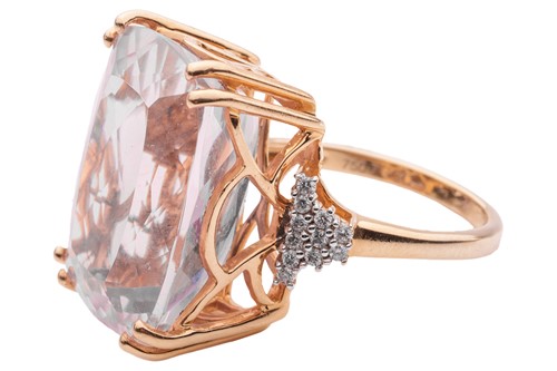 Lot 55 - A kunzite and diamond cocktail ring in 18ct...