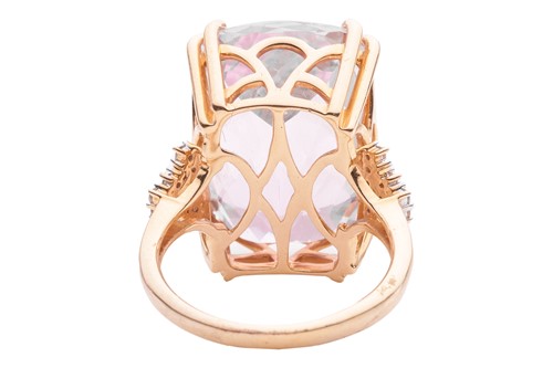 Lot 55 - A kunzite and diamond cocktail ring in 18ct...