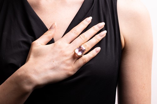 Lot 55 - A kunzite and diamond cocktail ring in 18ct...