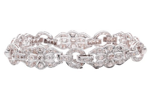 Lot 228 - A Late Art Deco diamond-set link bracelet,...