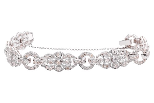 Lot 228 - A Late Art Deco diamond-set link bracelet,...