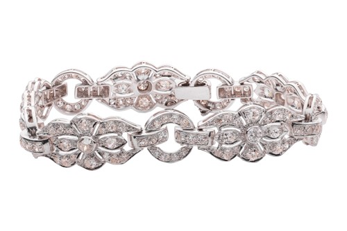 Lot 228 - A Late Art Deco diamond-set link bracelet,...