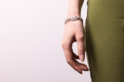 Lot 228 - A Late Art Deco diamond-set link bracelet,...