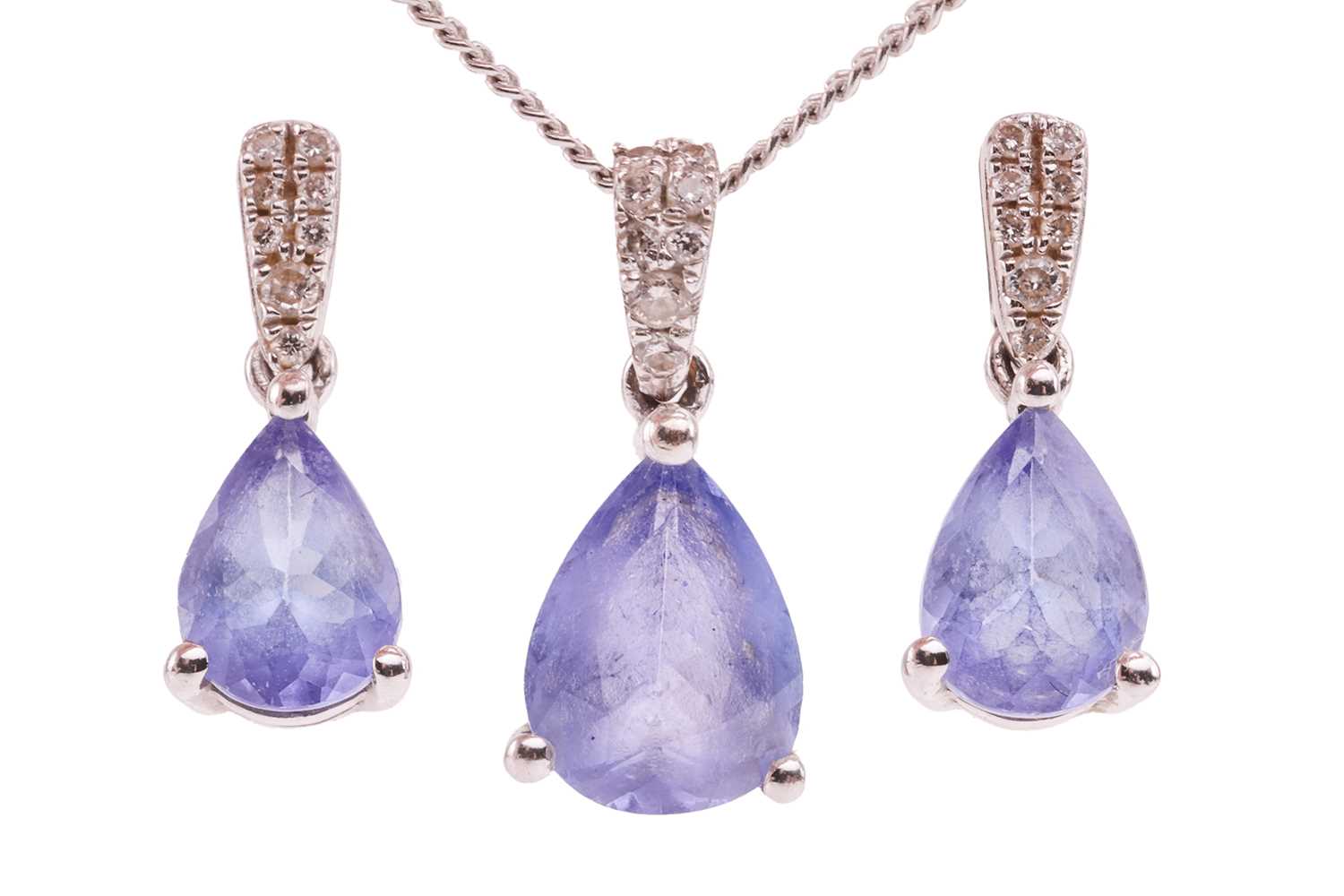 Lot 16 - A tanzanite-set pendant and earrings suite,...