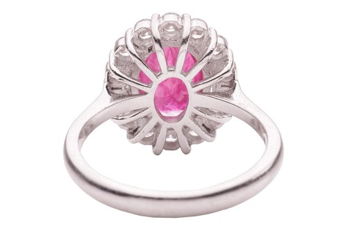 Lot 36 - A ruby and diamond cluster ring, comprising a...