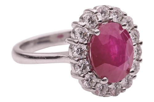 Lot 36 - A ruby and diamond cluster ring, comprising a...