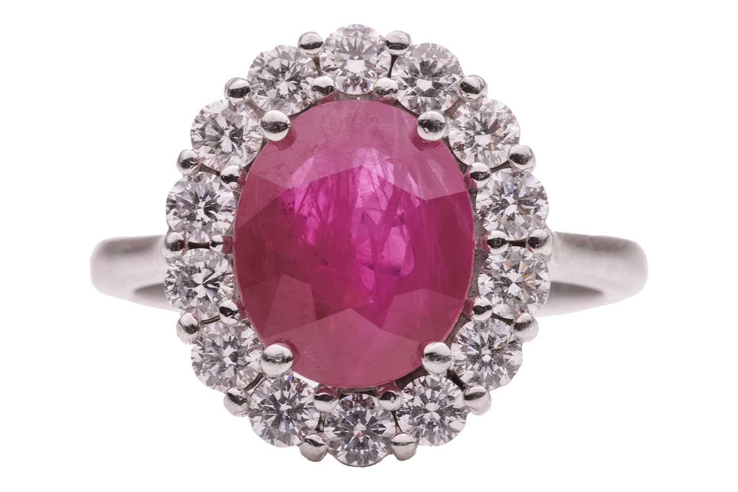 Lot 36 - A ruby and diamond cluster ring, comprising a...