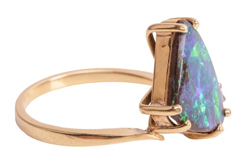 Lot 21 - A boulder opal dress ring, claw-set with a...