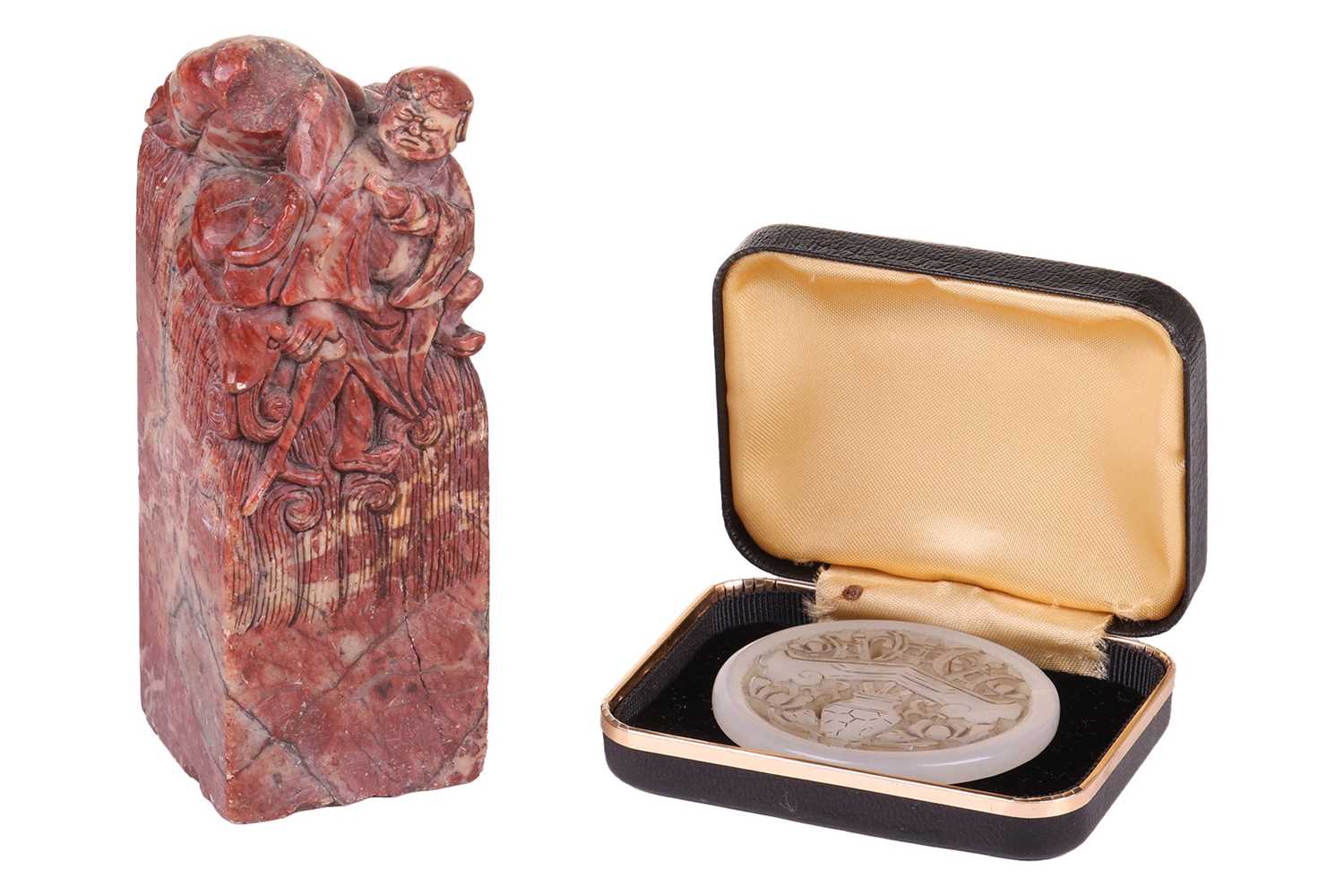 Lot 60 - A Chinese carved grey/green jade disk amulet...