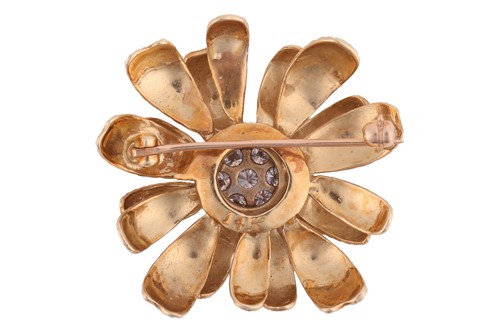 Lot 64 - A diamond-set floral brooch, the flower in...