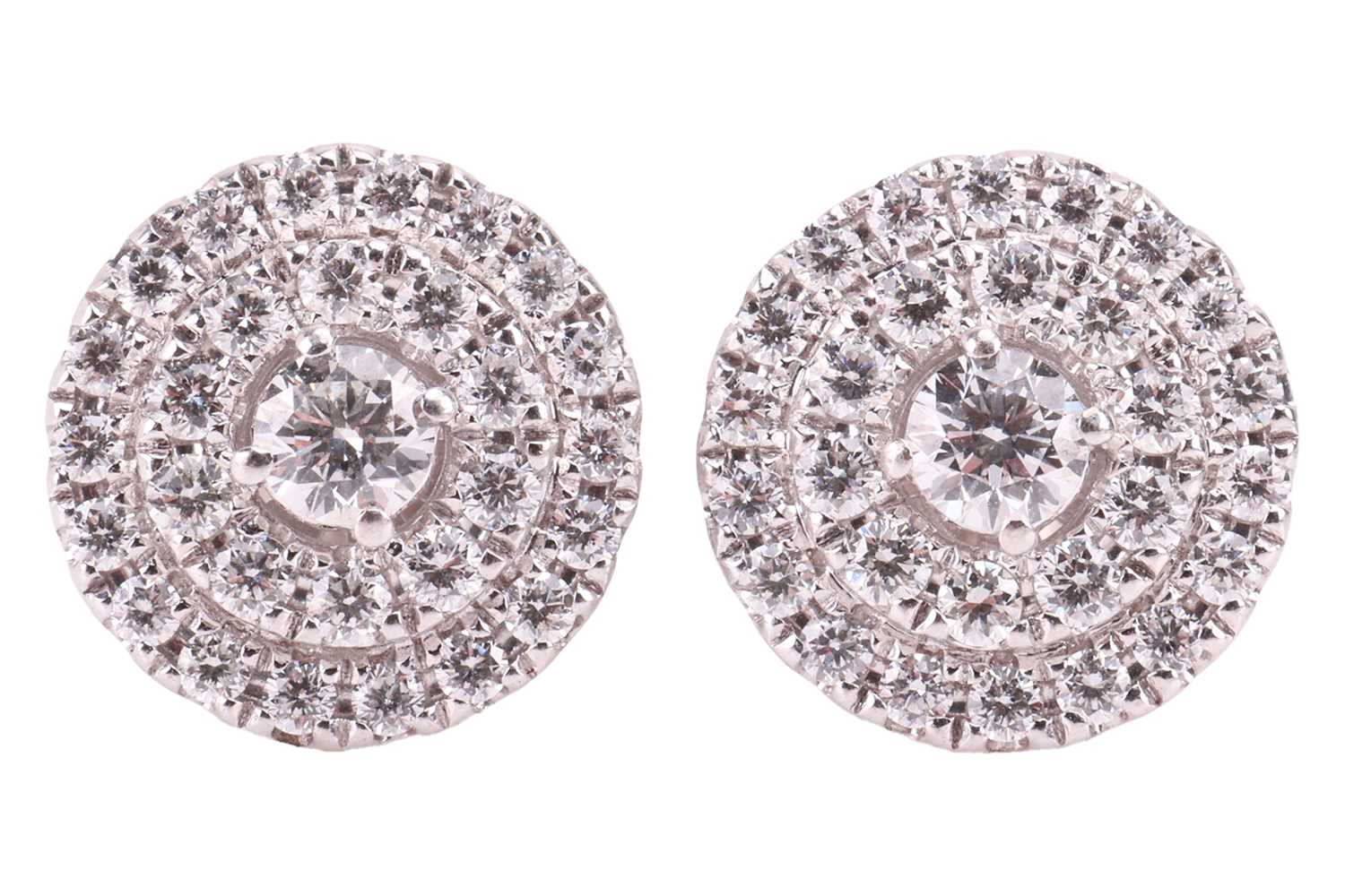 Lot 66 - A pair of diamond cluster earrings in 18ct...
