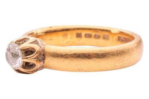 Lot 162 - A diamond single-stone ring in 22ct yellow...