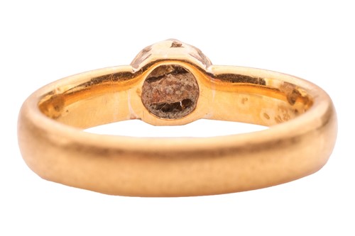 Lot 162 - A diamond single-stone ring in 22ct yellow...