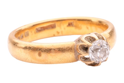 Lot 162 - A diamond single-stone ring in 22ct yellow...