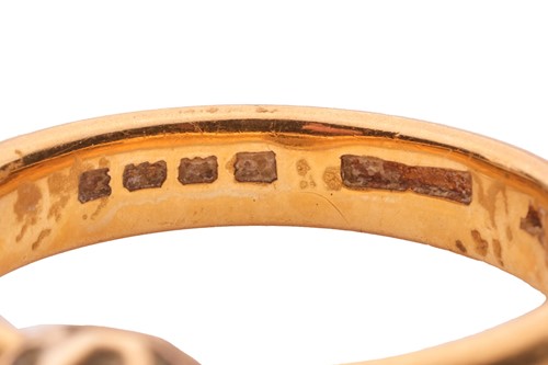 Lot 162 - A diamond single-stone ring in 22ct yellow...