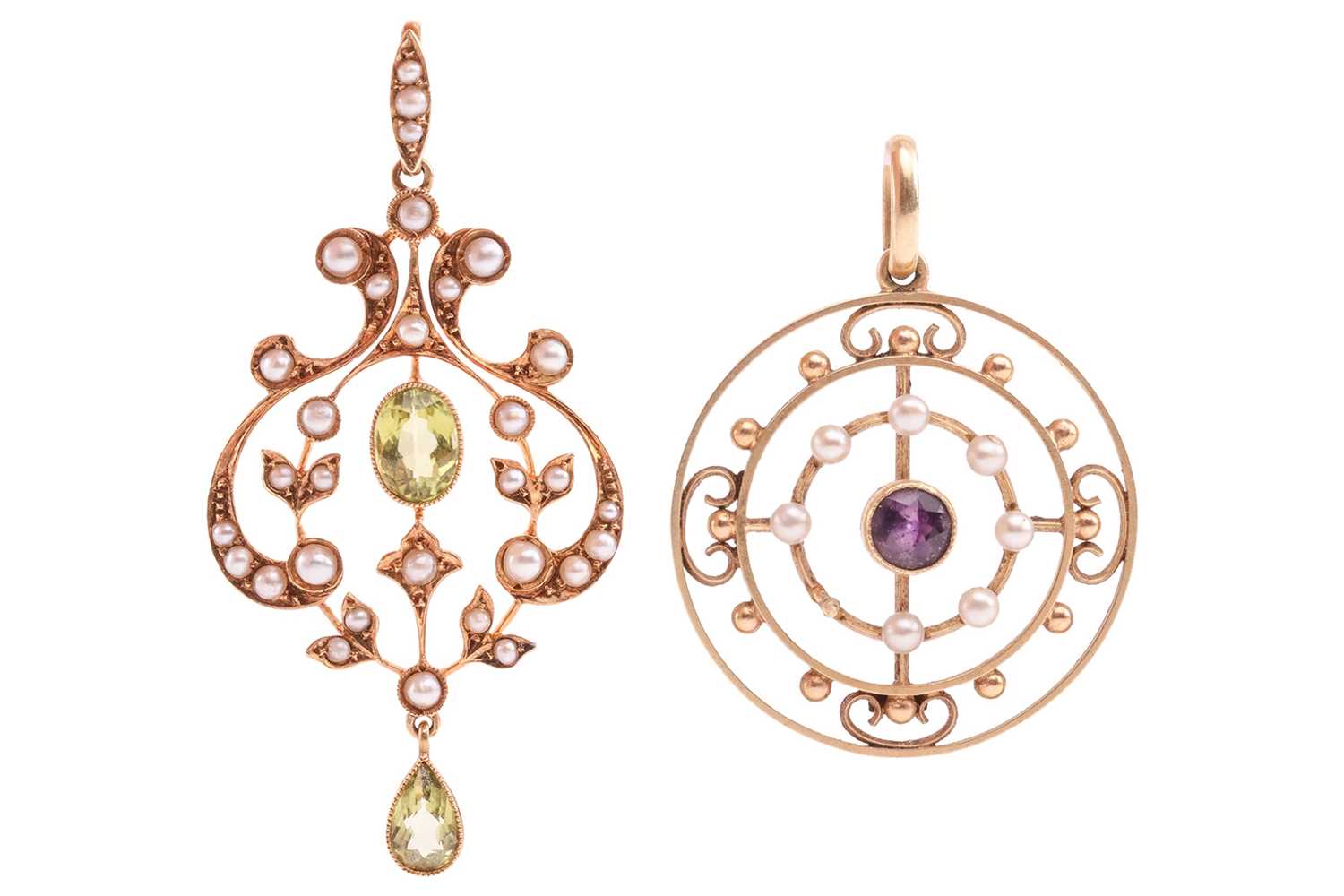Lot 142 - Two Edwardian gem-set pendants; to include a...