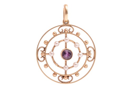 Lot 142 - Two Edwardian gem-set pendants; to include a...
