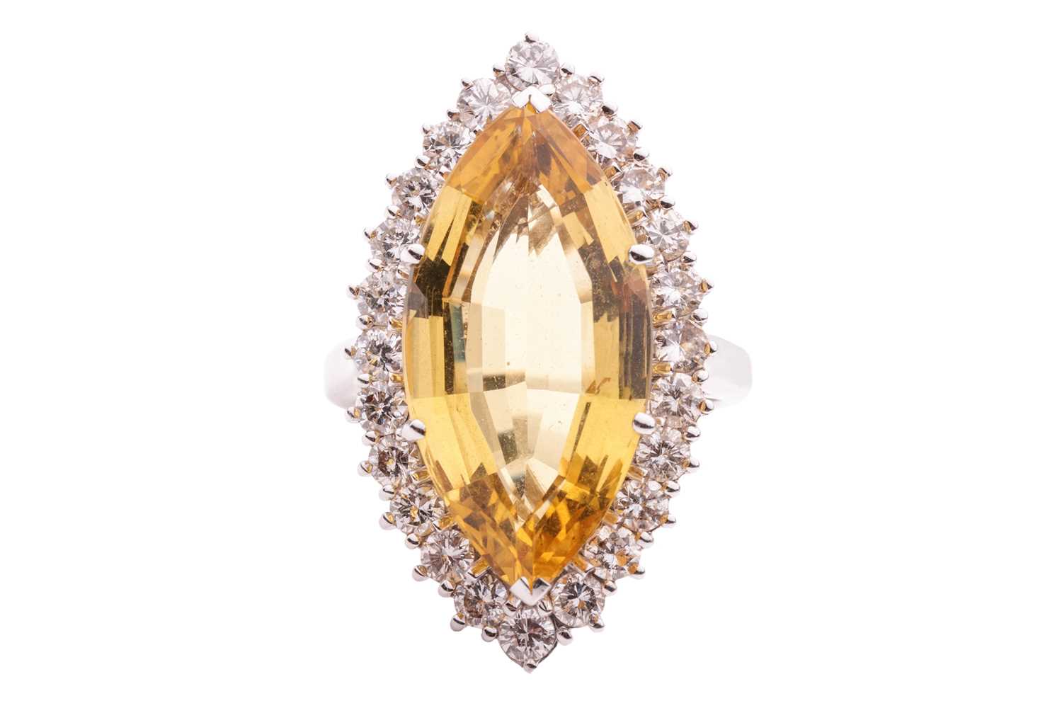 Lot 108 - A heliodor and diamond halo ring, centred with...