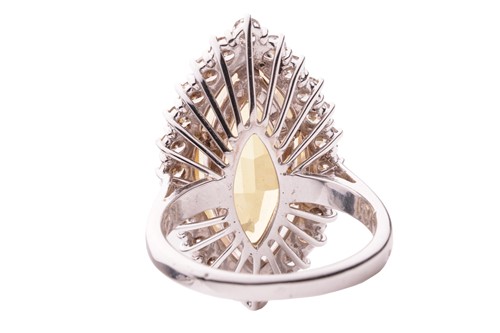 Lot 108 - A heliodor and diamond halo ring, centred with...