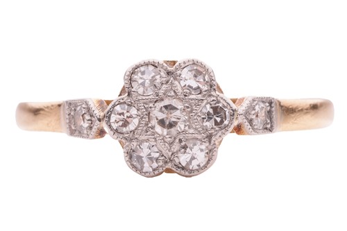 Lot 186 - A diamond-set floral cluster ring; the daisy...