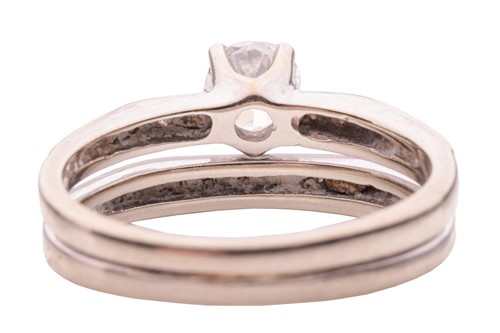 Lot 181 - A diamond-set ring, composed of a split shank...