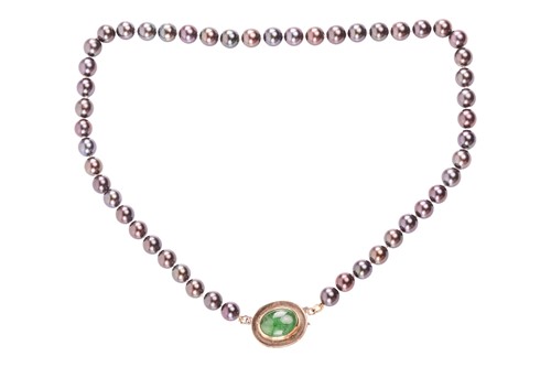 Lot 47 - A single-strand of Tahitian pearls with an...