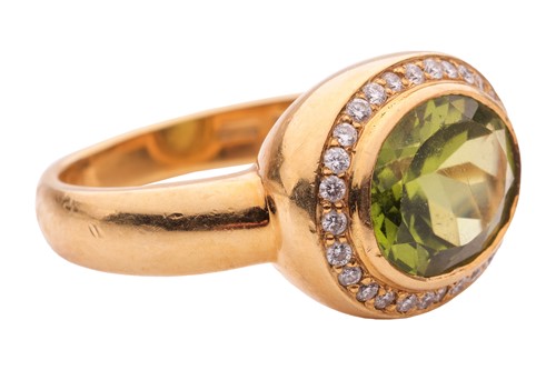Lot 19 - A peridot and diamond cluster ring by Kiki...